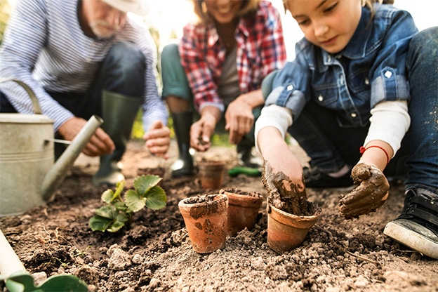 parents-and-kid-potting-plants