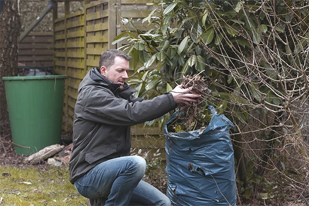 man-tidying-garden